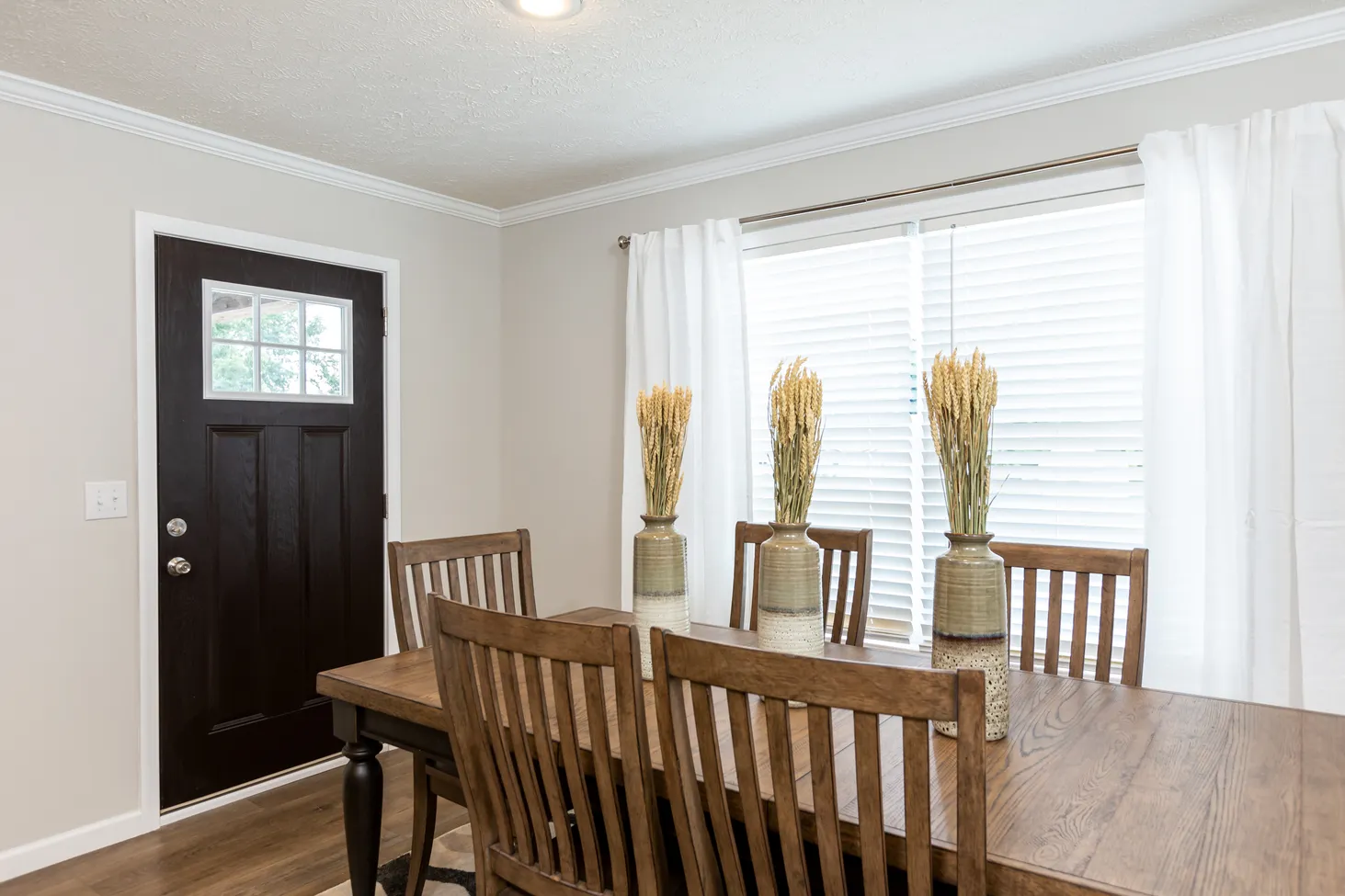 Dining room with table that fits six chairs