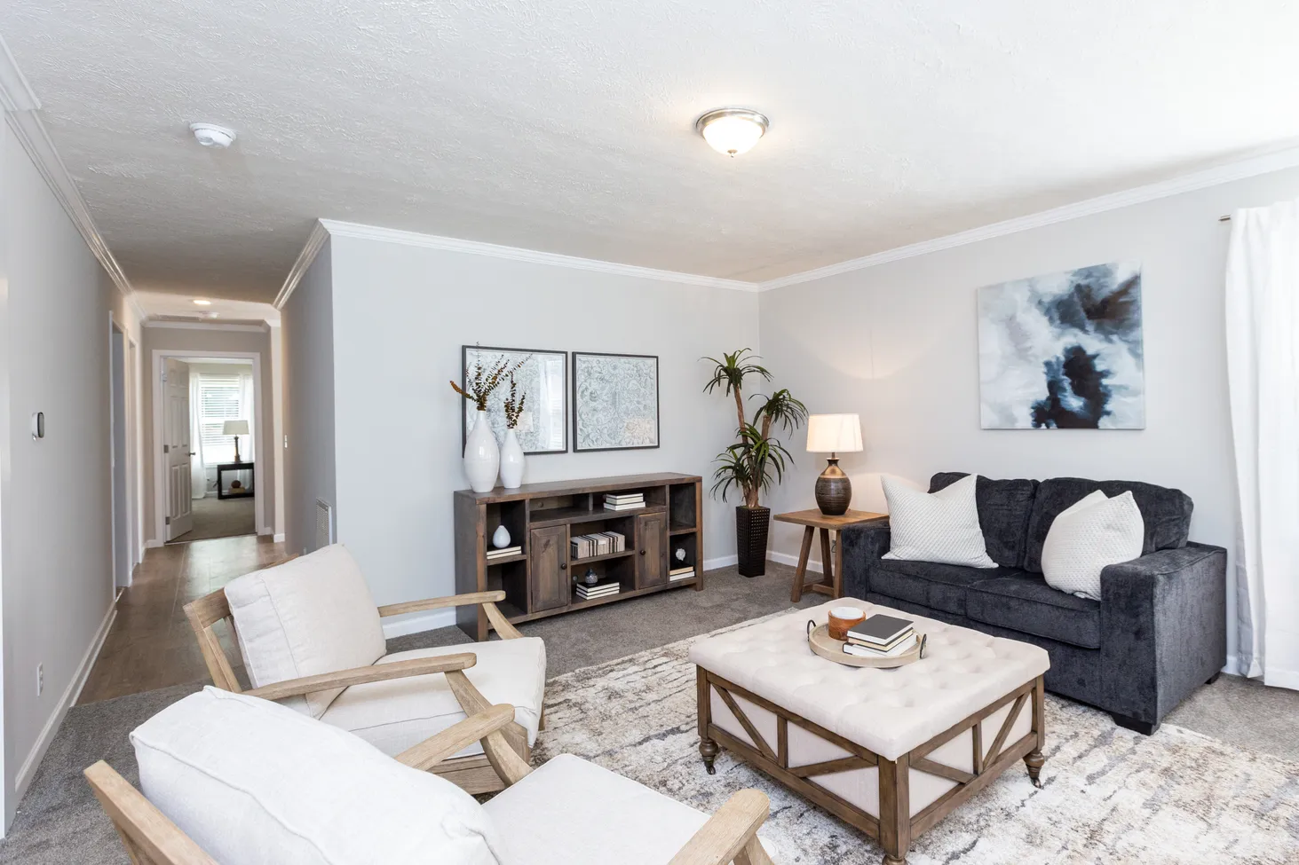 Medium-sized living room with a loveseat and two chairs