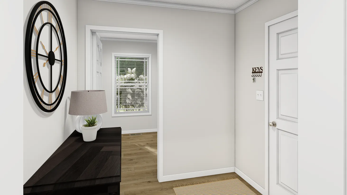 Entryway with brown entry table and a clock