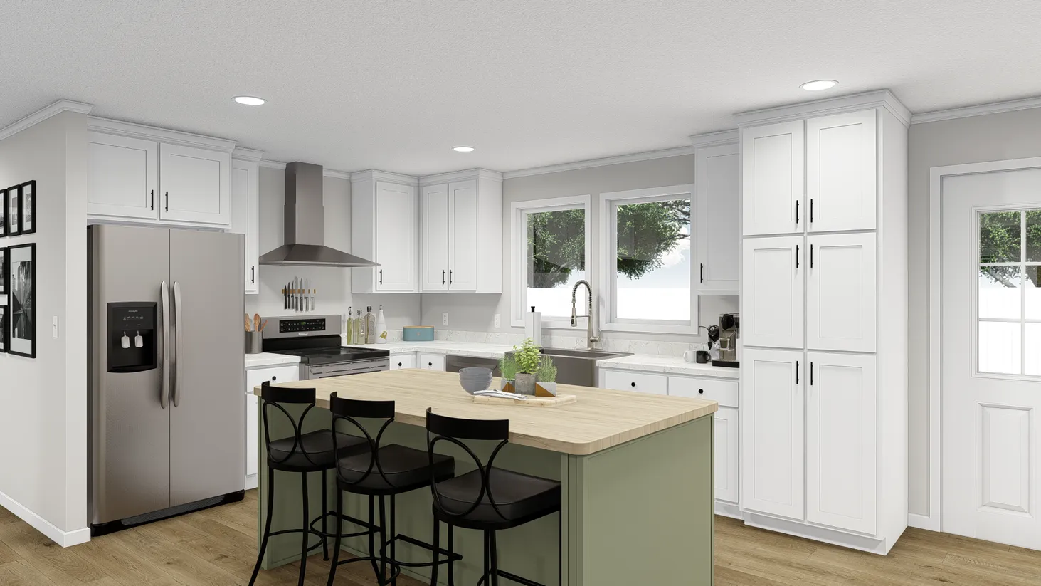 Kitchen with white cabinets and a green island topped with a wooden countertop