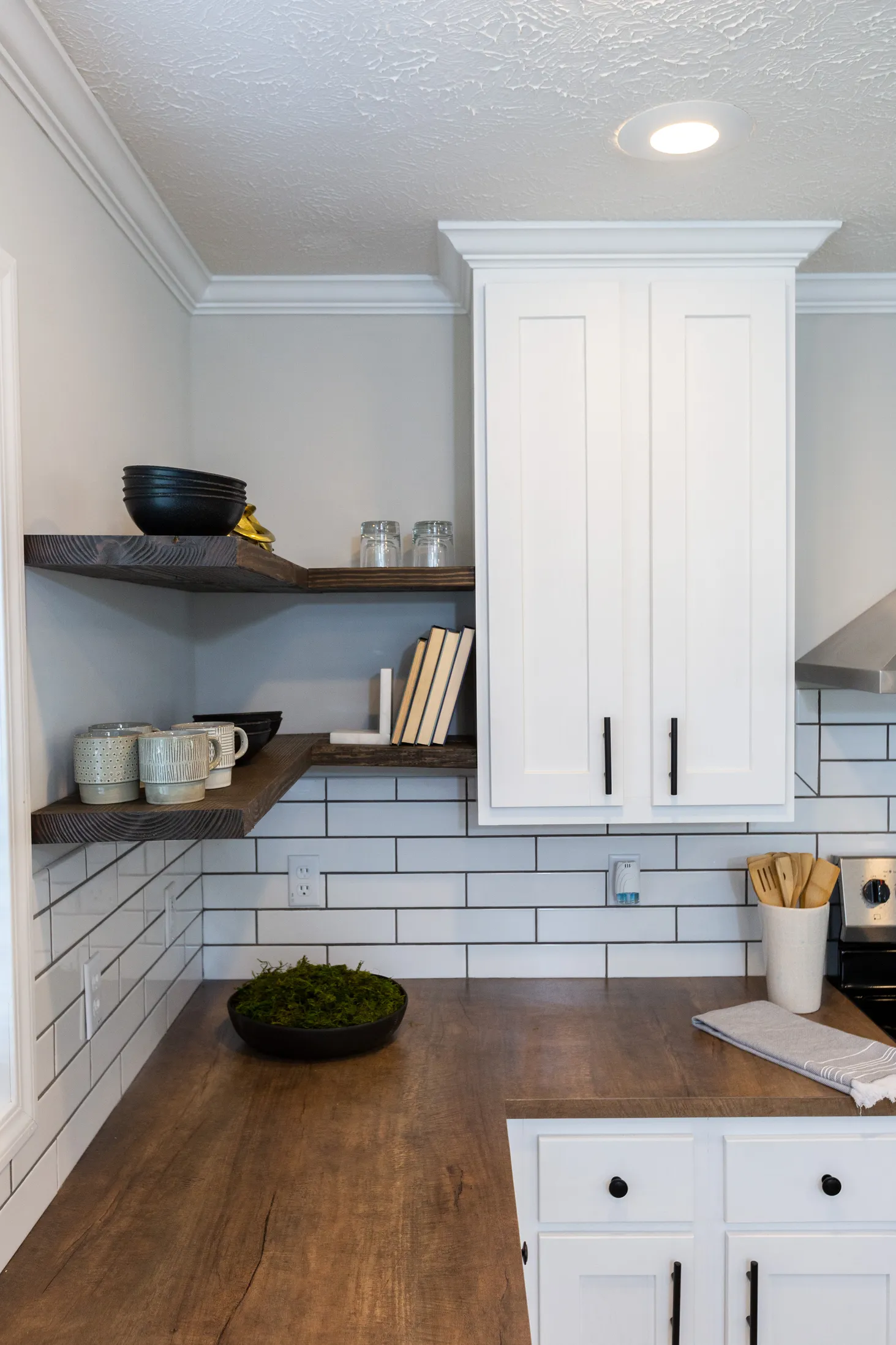 Close-up of kitchen countertop and white cabinet
