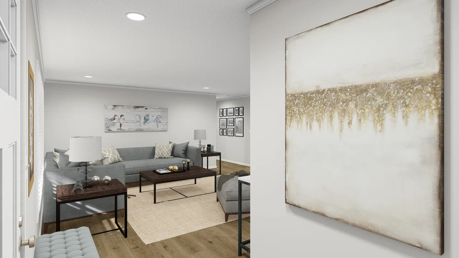 Partial view of a living room with grey couches.
