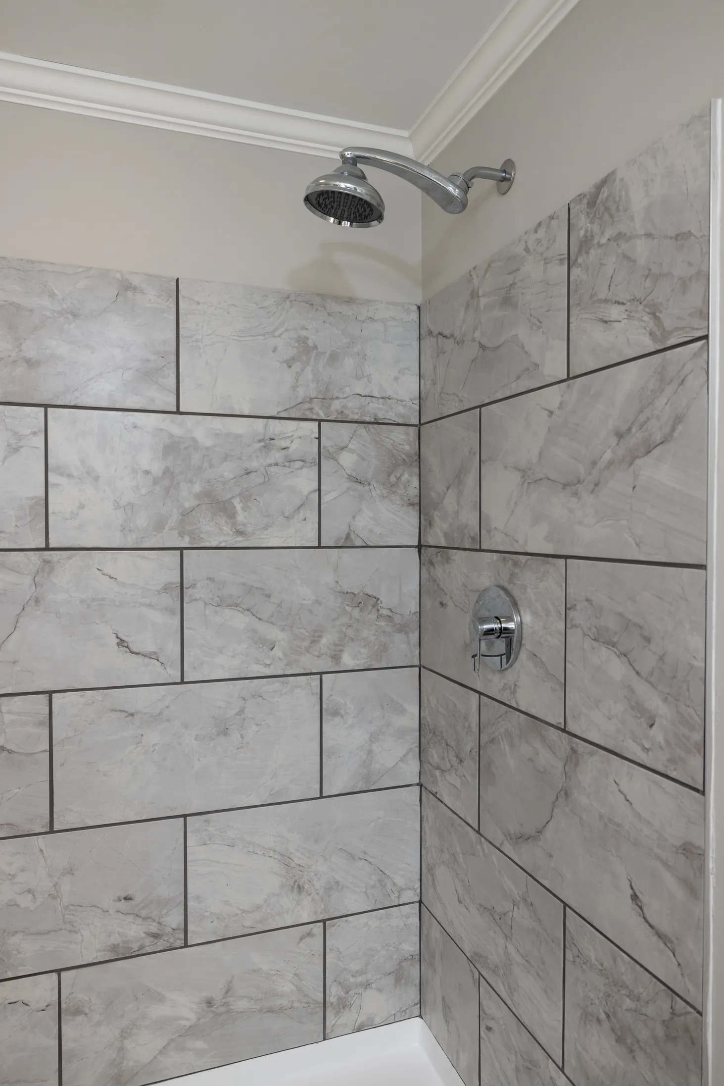 Shower with marble textured walls